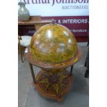 A terrestrial globe cocktail cabinet/trolley