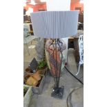 A cast metal floor standing lamp