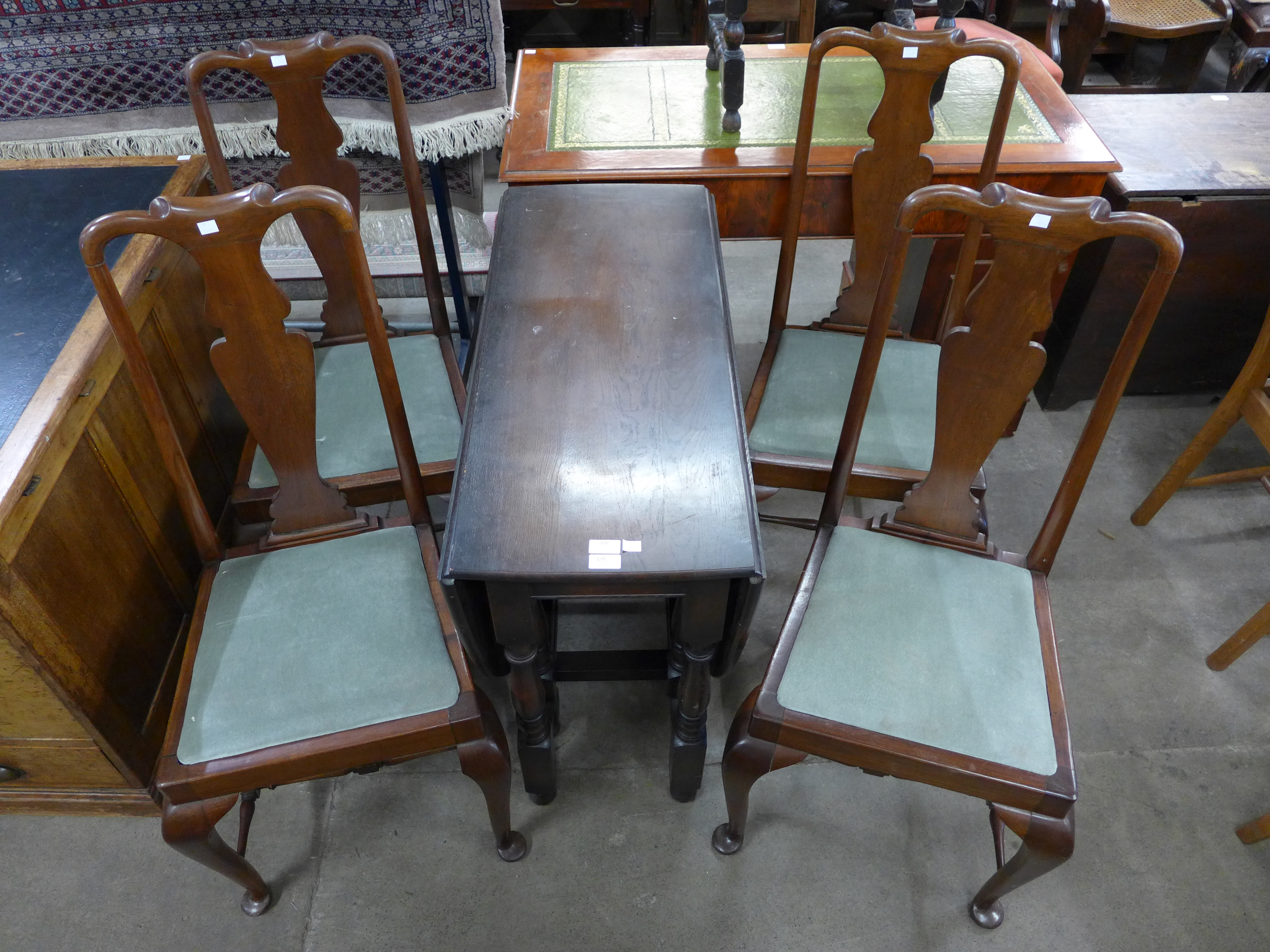 An oak gateleg table and four Queen Anne style mahogany chairs