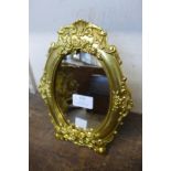 A Victorian style ormolu strut mirror