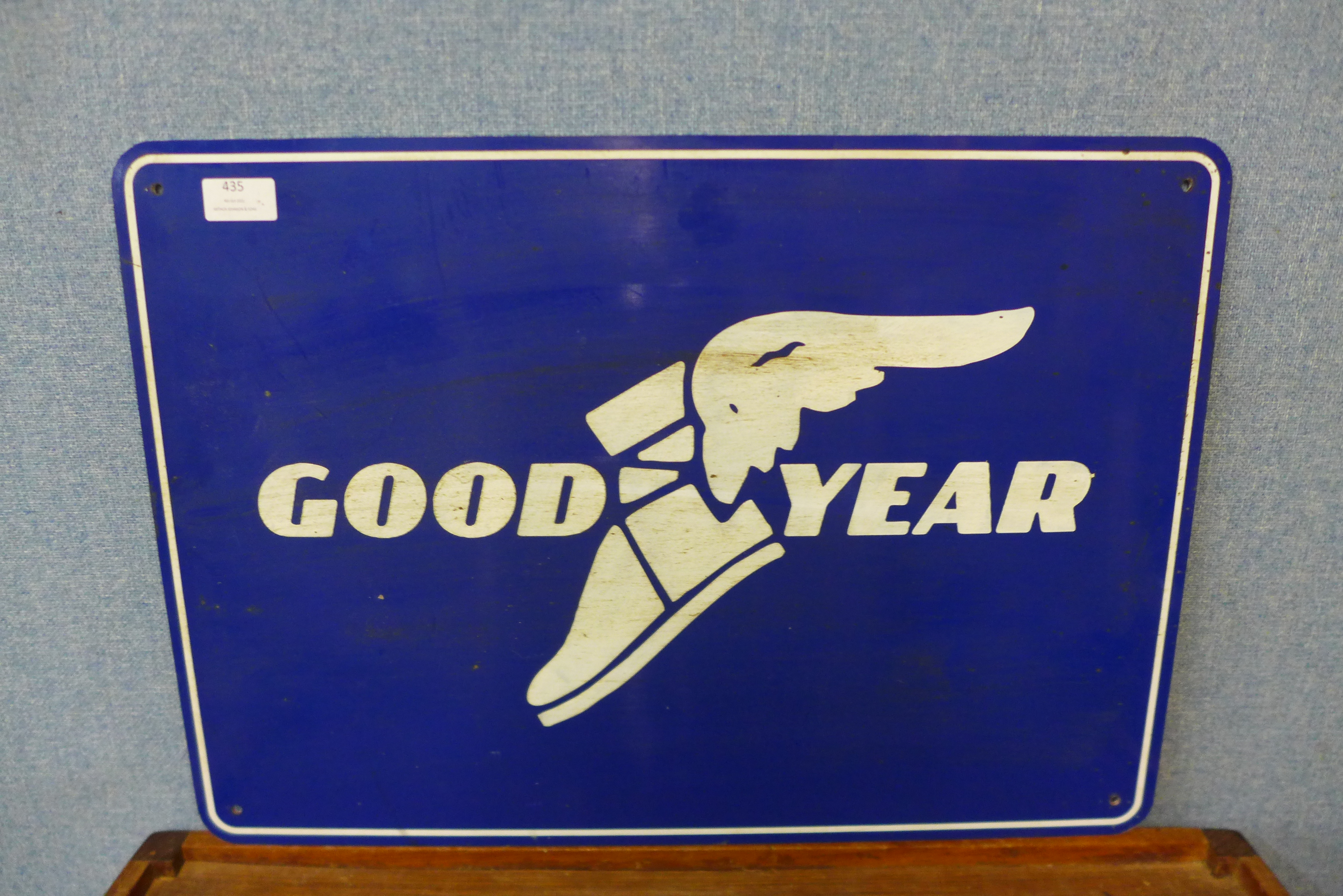 An aluminium painted Good Year sign