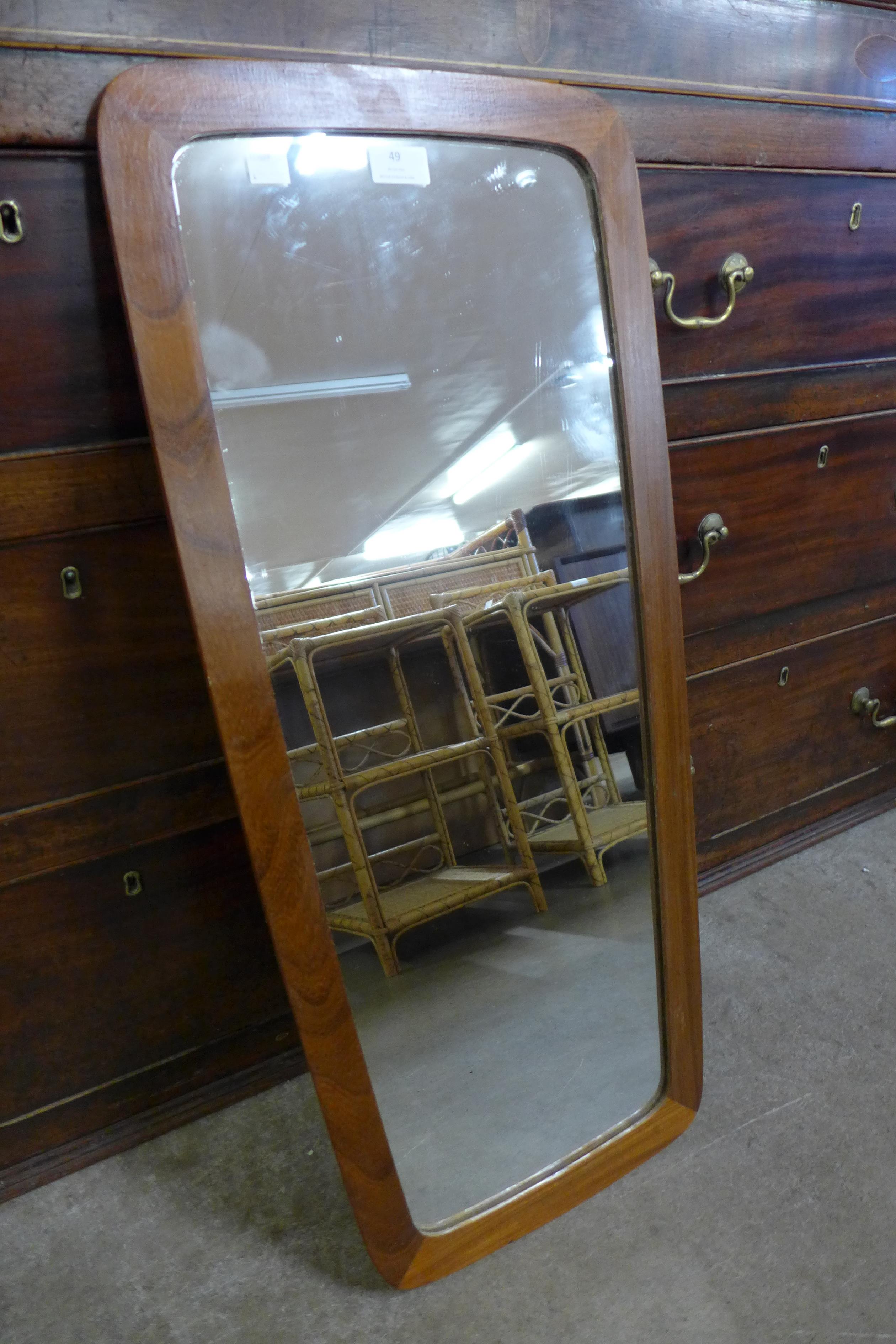 A teak framed mirror