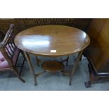 An Edward VII inlaid mahogany two tier oval occasional table