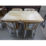 A pine scrub-top kitchen table and four chairs