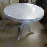 An aluminium bistro table