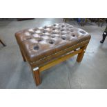 A mahogany and tan buttoned leather footstool