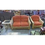 A rattan three piece suite