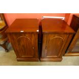 A pair of Victorian mahogany pedestal cabinets