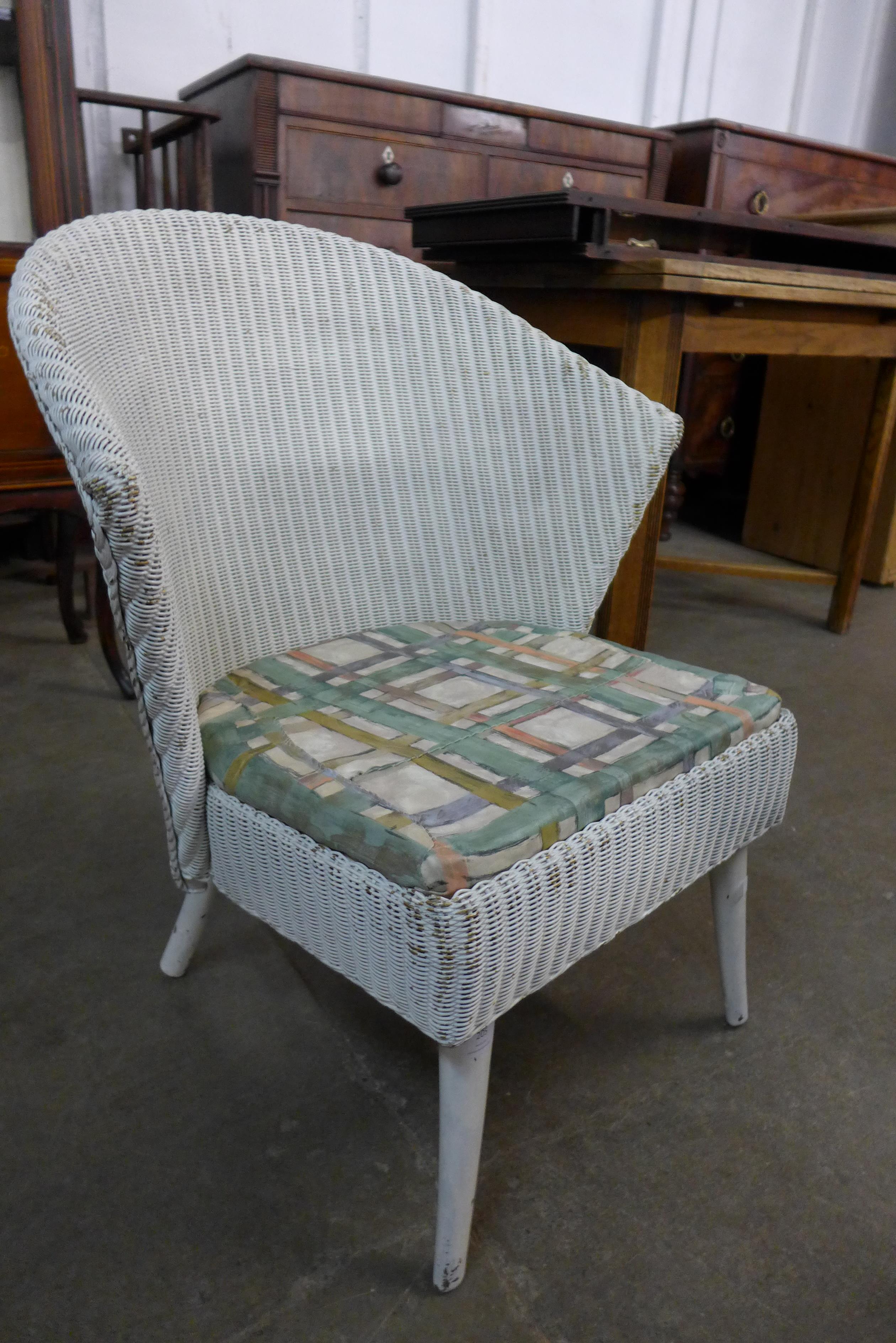 A Lloyd Loom Lusty white painted wicker chair