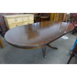 A Regency style mahogany extending dining table