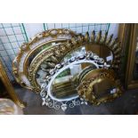 Six assorted gilt framed mirrors and one other