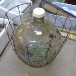 A clear glass carboy