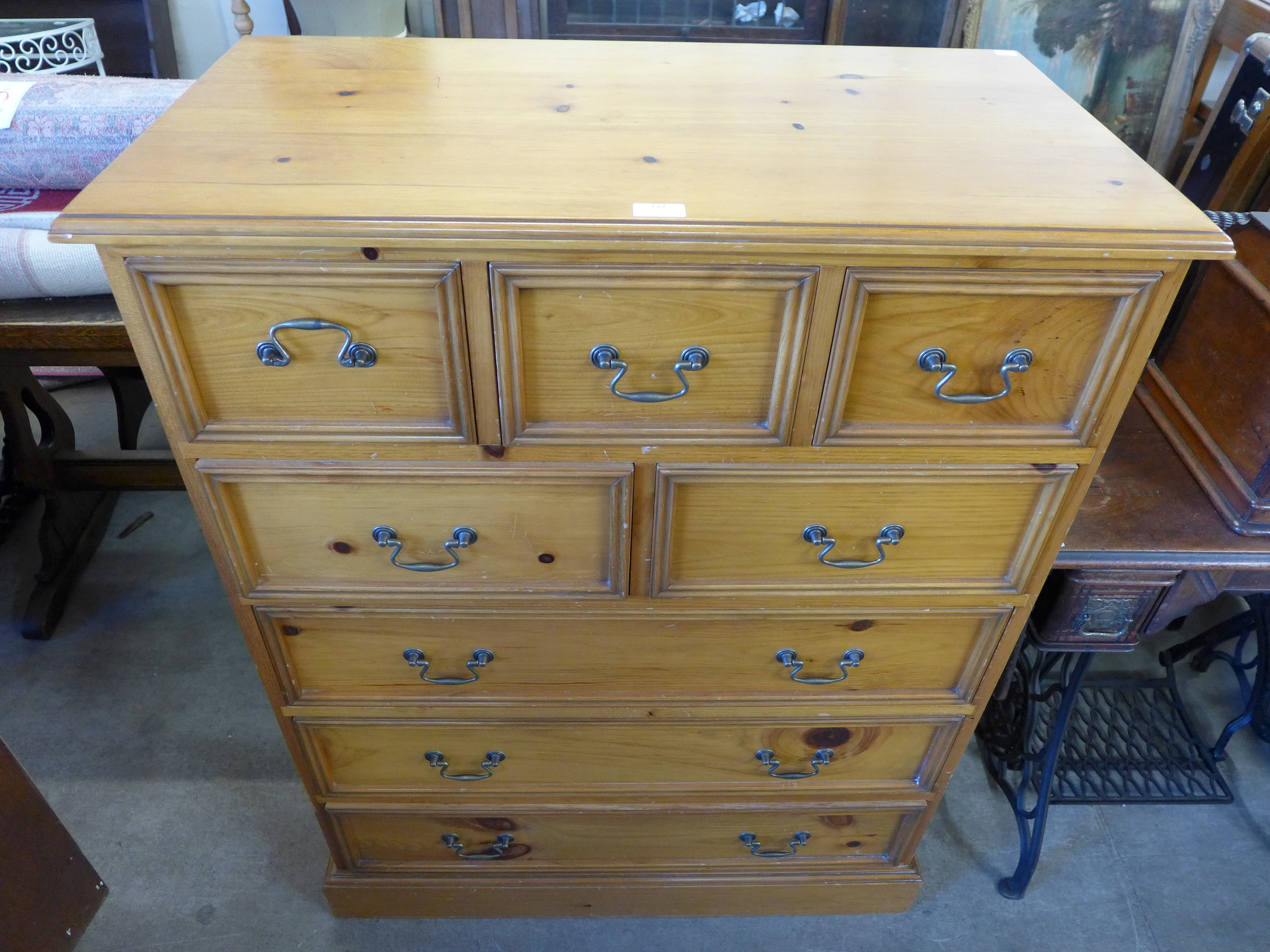 A pine chest of drawers