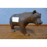A Black Forest carved softwood bear, 10cms h