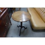 A George III mahogany circular tilt top tripod table