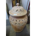 An Italian style terracotta olive jar