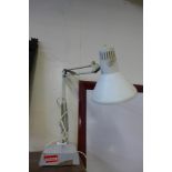 A white metal anglepoise lamp