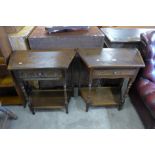 A pair of carved oak single drawer hall tables