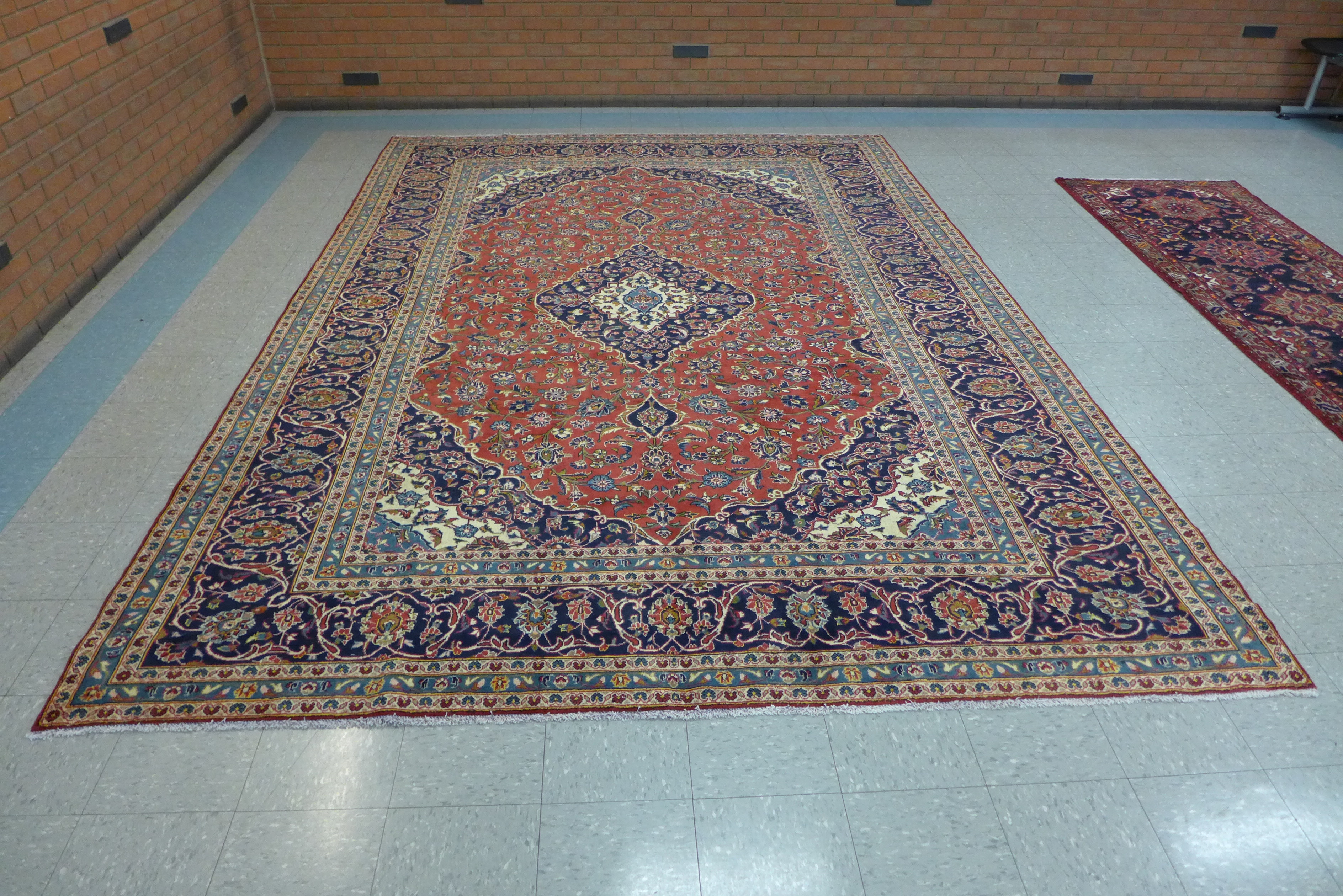 A large Persian red ground Kashan rug, 410 x 283cms