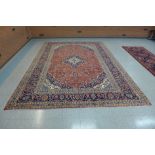 A large Persian red ground Kashan rug, 410 x 283cms