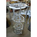 A painted cast iron plant stand