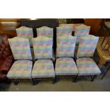 A set of eight oak and fabric upholstered dining chairs