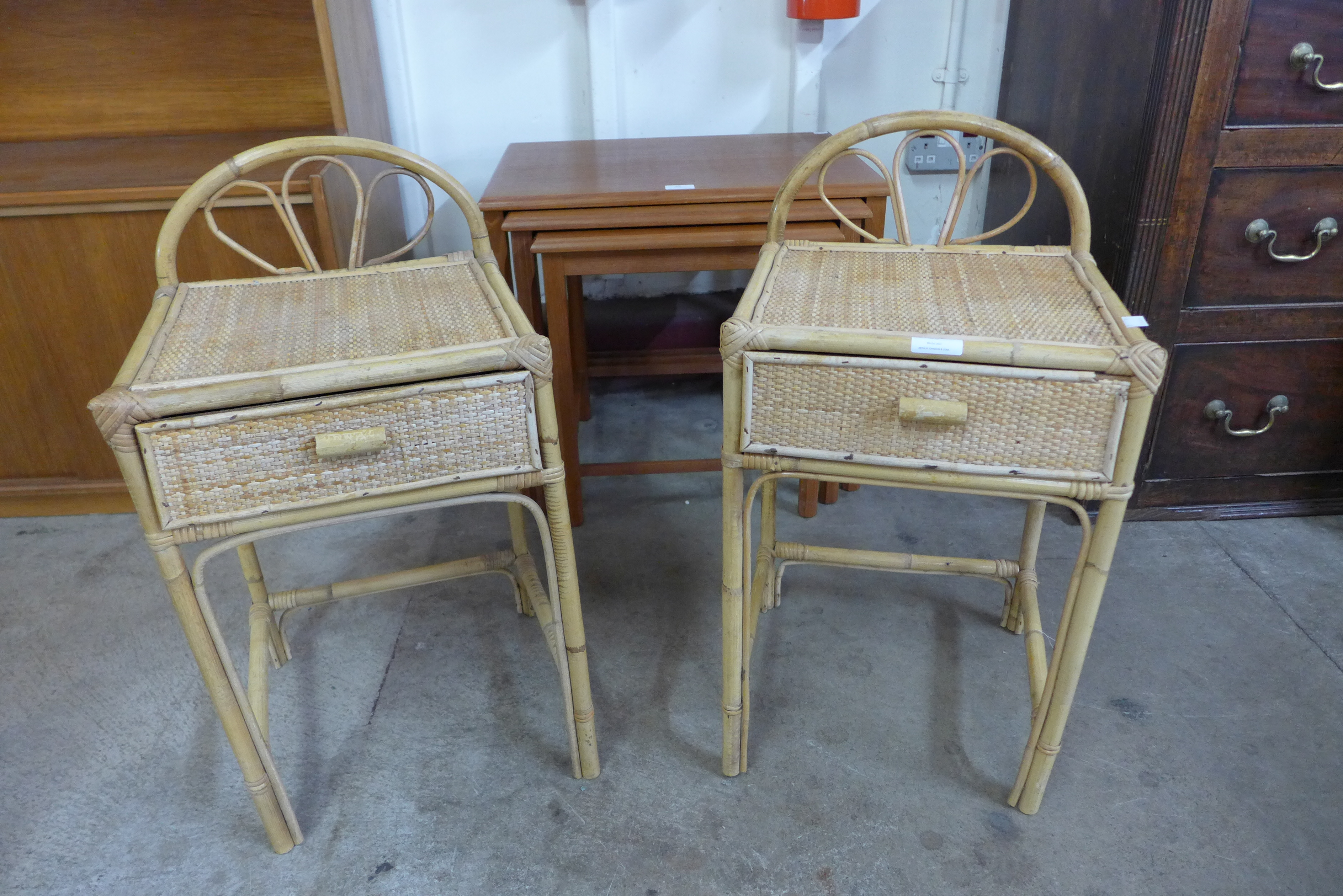 A pair of bamboo and rattan single drawer bedside tables