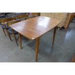 A teak extending dining table