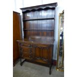 An oak geometric moulded dresser