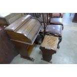 A small oak tambour roll-top desk and a stool