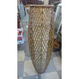 A wicker floor standing lamp