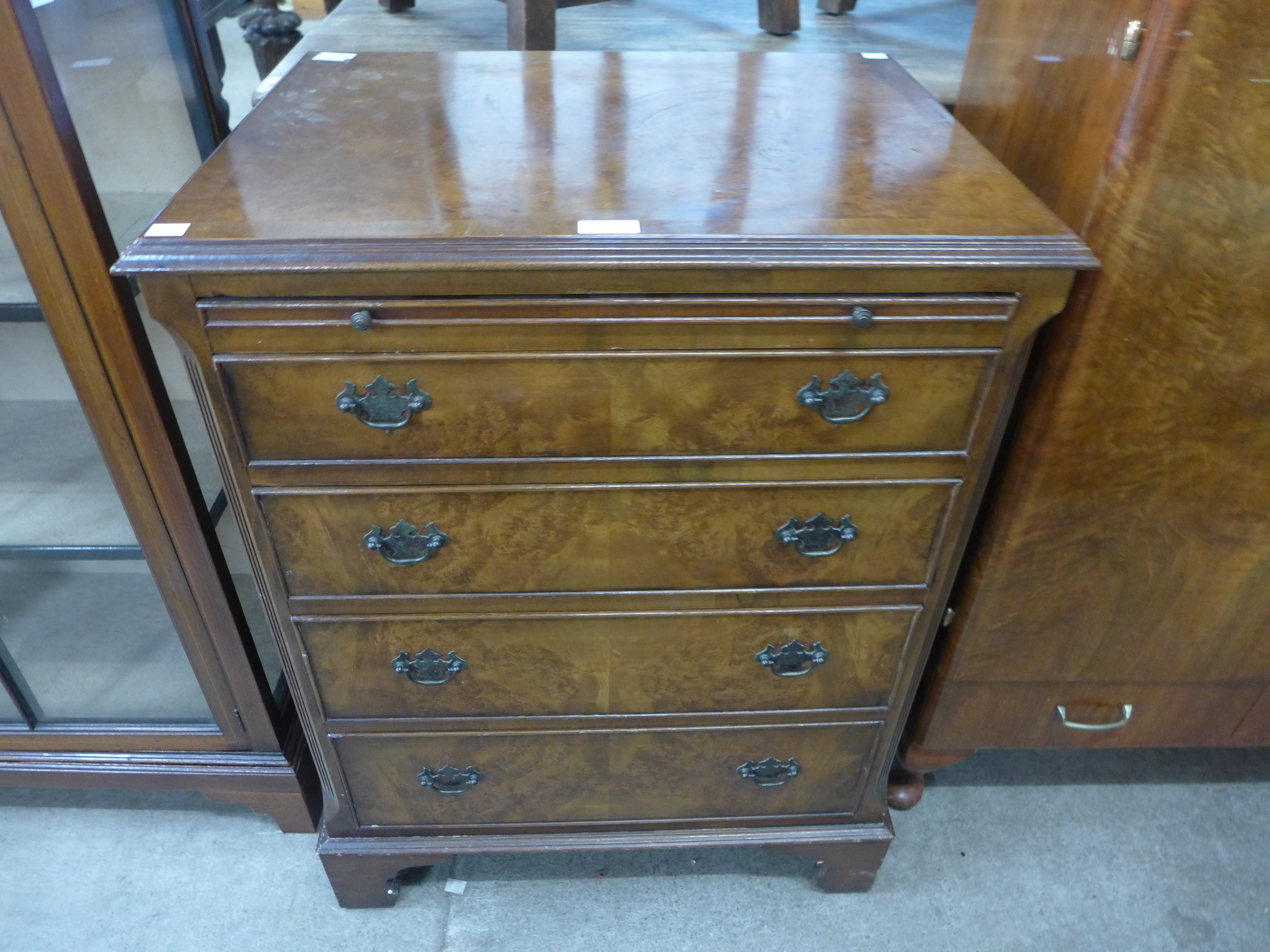 A George III style walnut chest of drawers