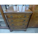 A George III style walnut chest of drawers
