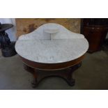 A Victorian carved mahogany and marble topped washstand