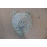 A bear head concrete garden wall mask