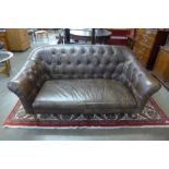 A Chesterfield style chestnut brown buttoned leather settee