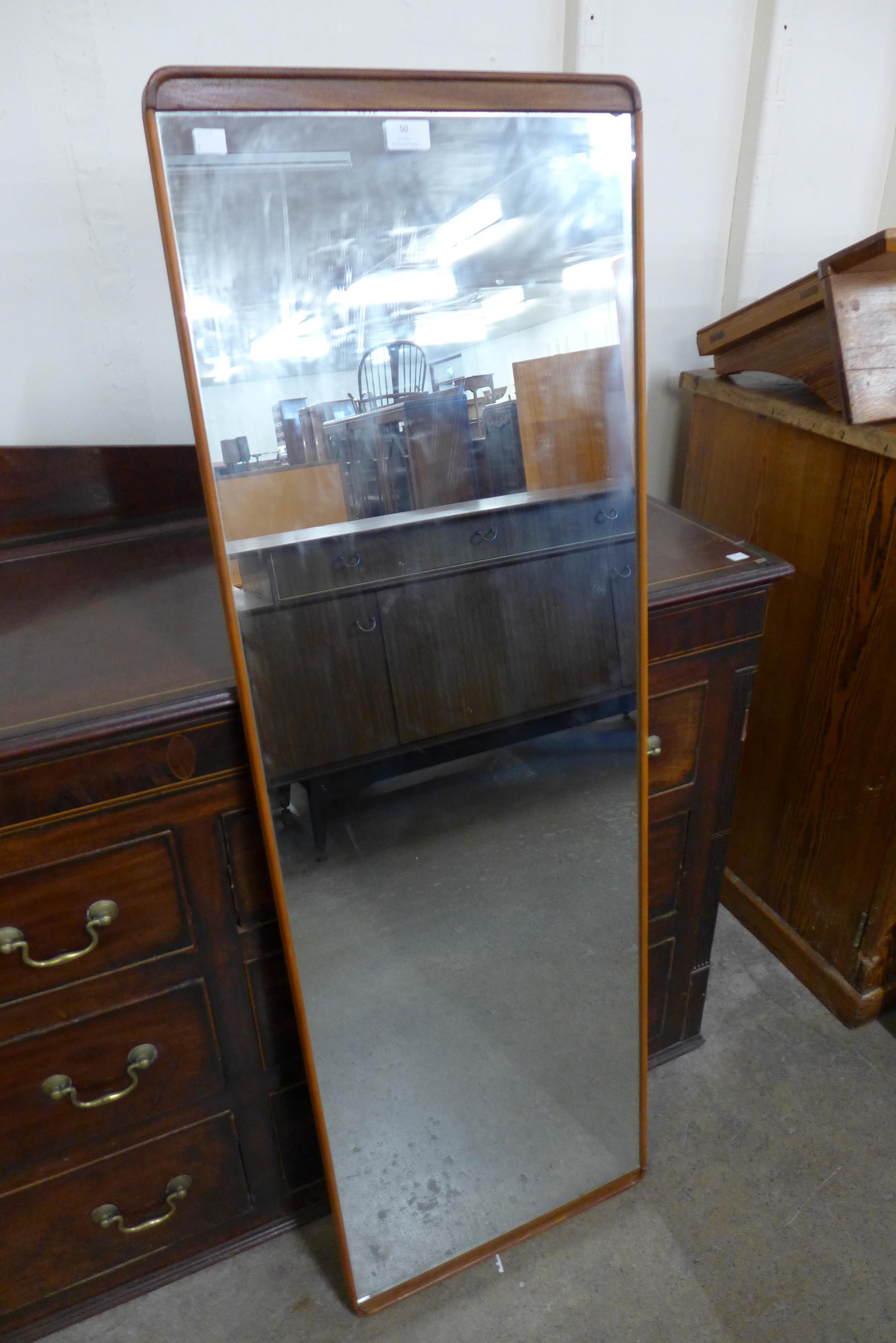 A teak framed mirror