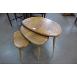 An Ercol Blonde elm and beech pebble shaped nest of tables