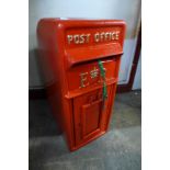 A red painted cast iron Post Office box