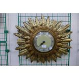 A Smiths sunburst wall clock