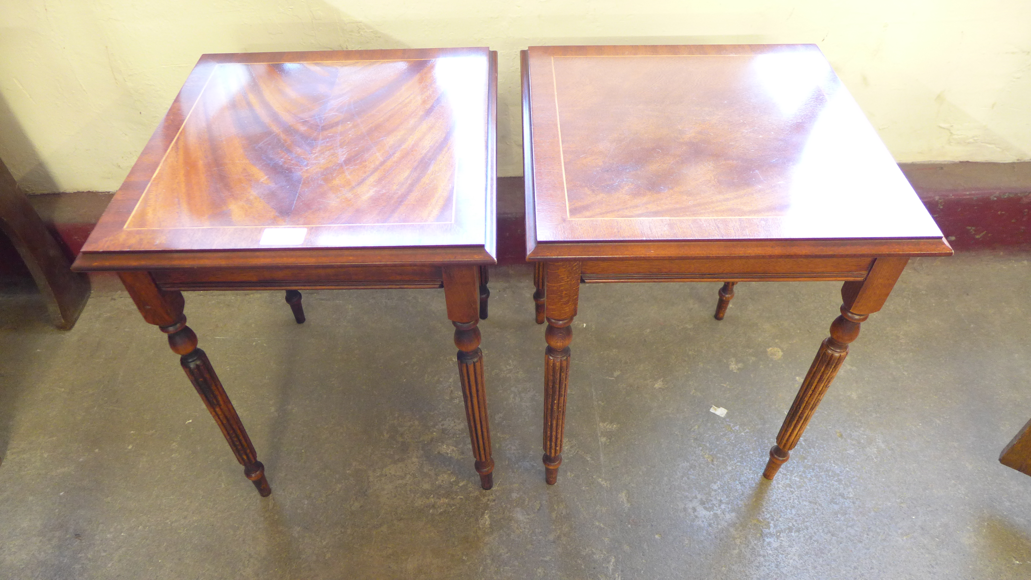 A pair of inlaid mahogany occasional tables