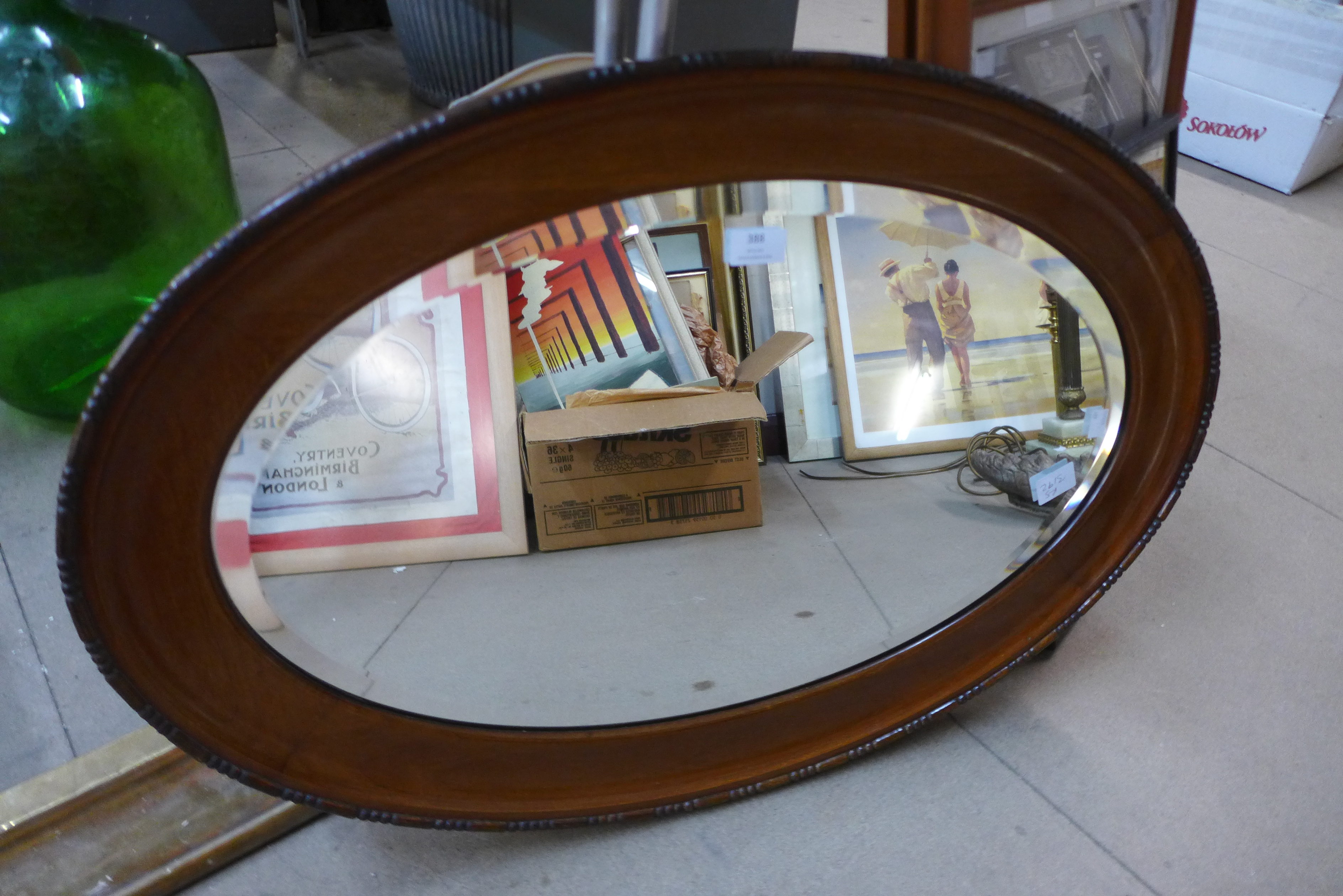 An Edward VII mahogany oval framed mirror