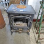 A French cast iron log burning stove