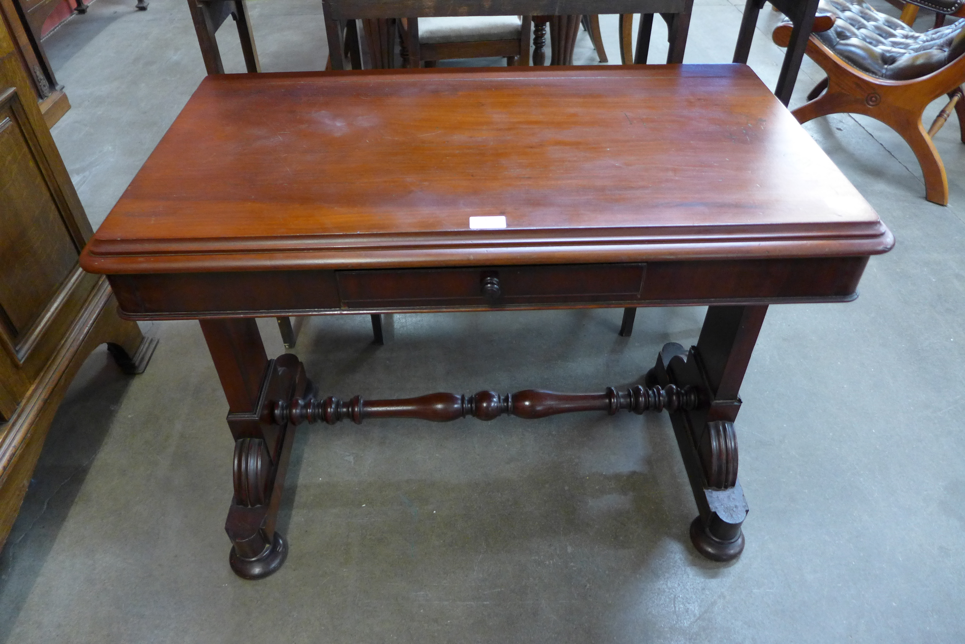 A Victorian mahogany single drawer stretcher table