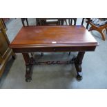 A Victorian mahogany single drawer stretcher table
