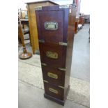 A small hardwood and brass mounted campaign style chest of drawers