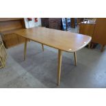 An Ercol Blonde elm and beech plank top dining table
