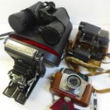 A quantity of cameras and binoculars including Praktika LLC 35mm