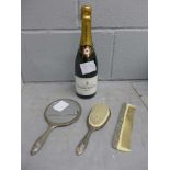 A bottle of Pierre Darcys champagne, a plated mirror, brush and comb
