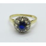 An 18ct gold sapphire and diamond cluster ring, 2.9g, M